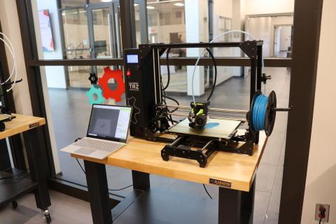 3D Printer printing in blue filament